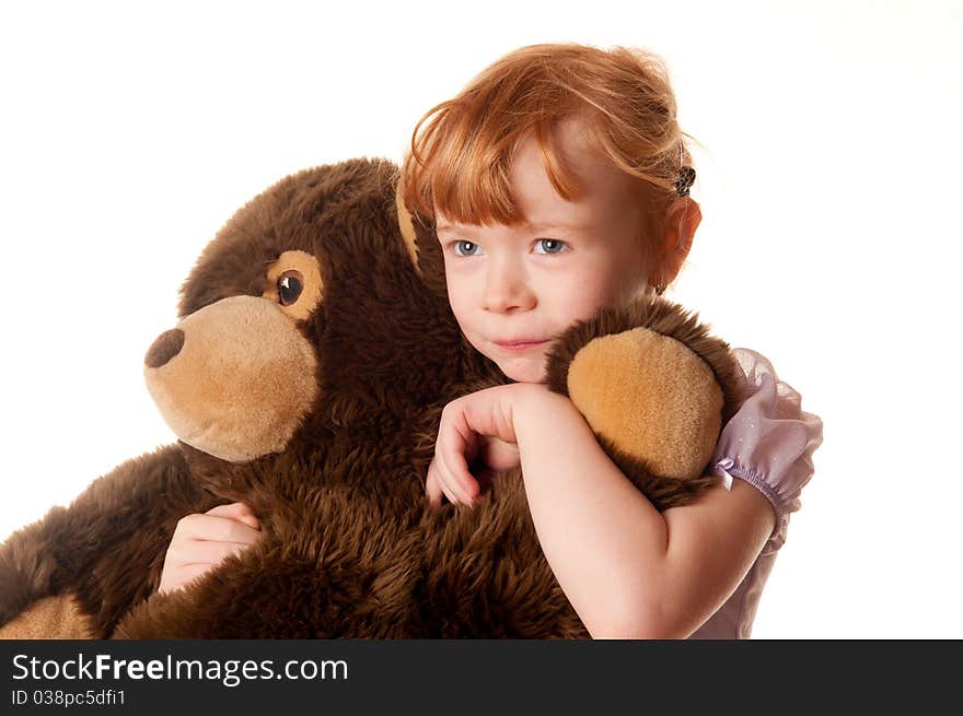 Cute little girl in pink dress holding a teddy bear. Cute little girl in pink dress holding a teddy bear