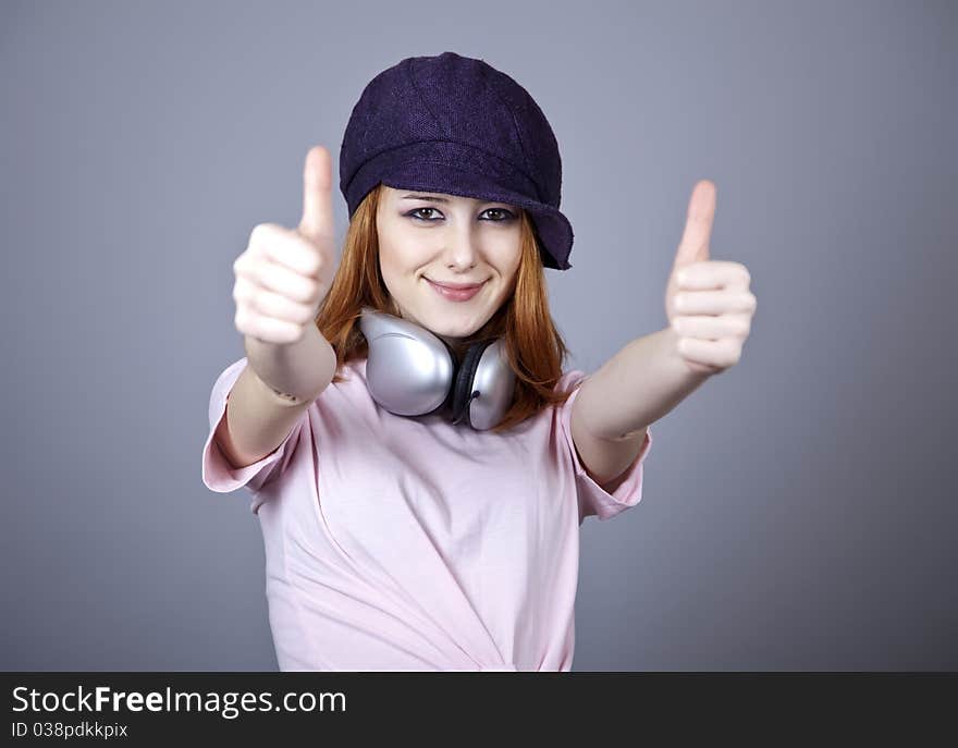 Fashion girl with headphone. Studio shot.