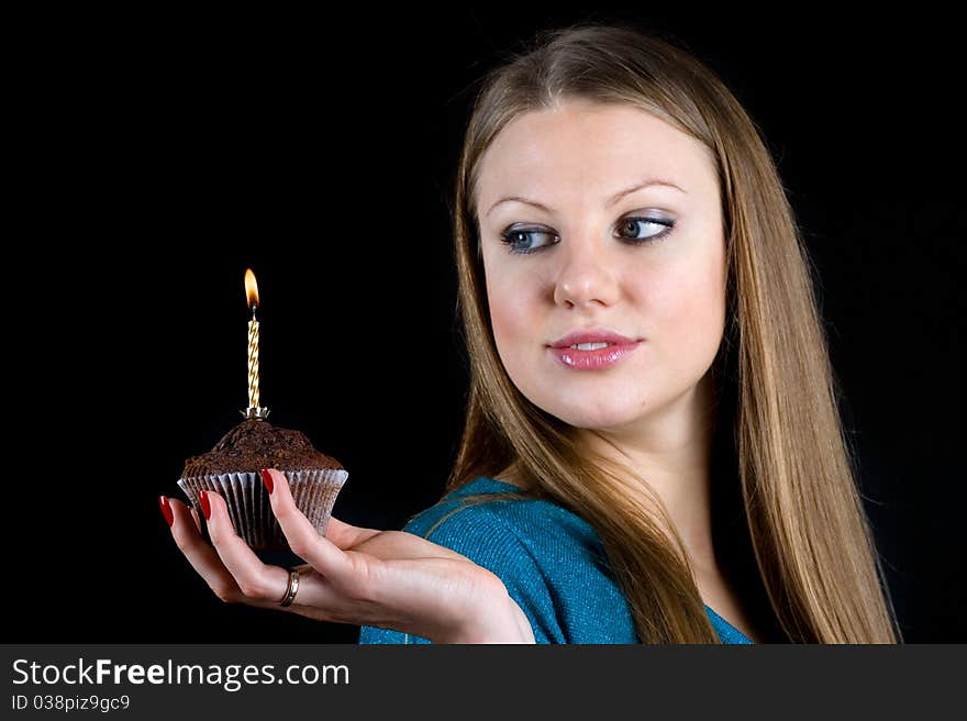 Girl holding a celebratory muffin