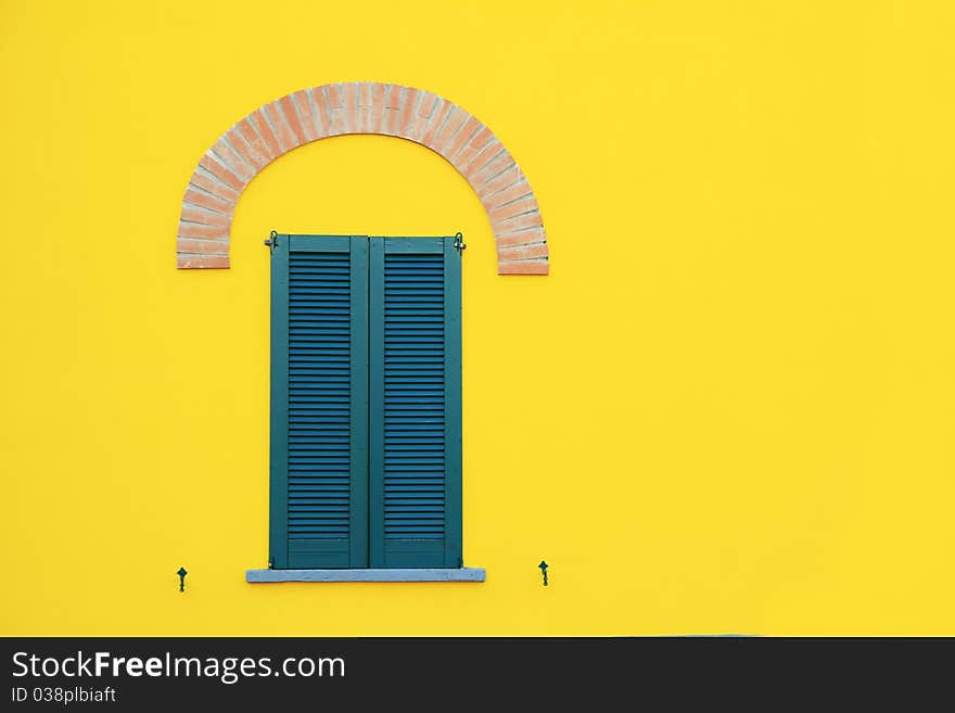 Style window in a yellow building copy space concept. Style window in a yellow building copy space concept