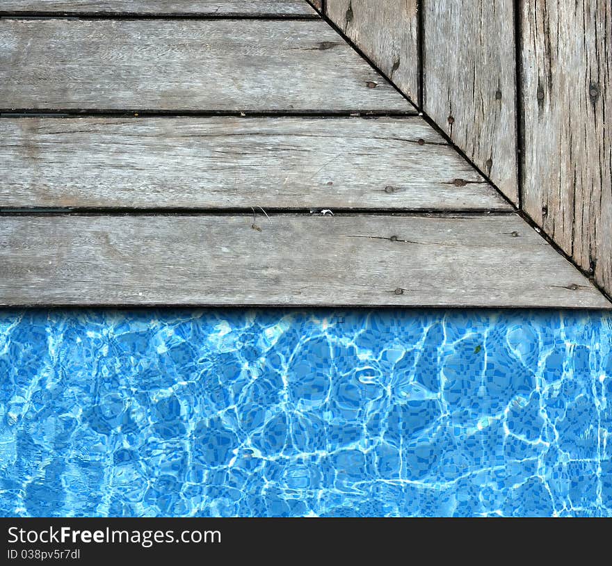 Wood pavement with pool background