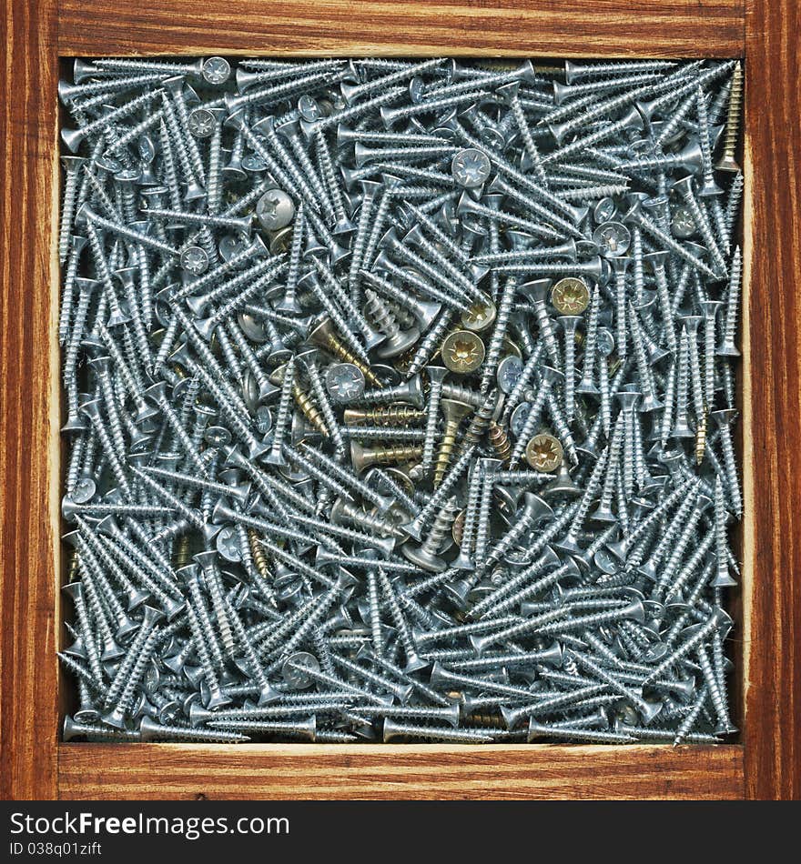 Screws in the old wooden box