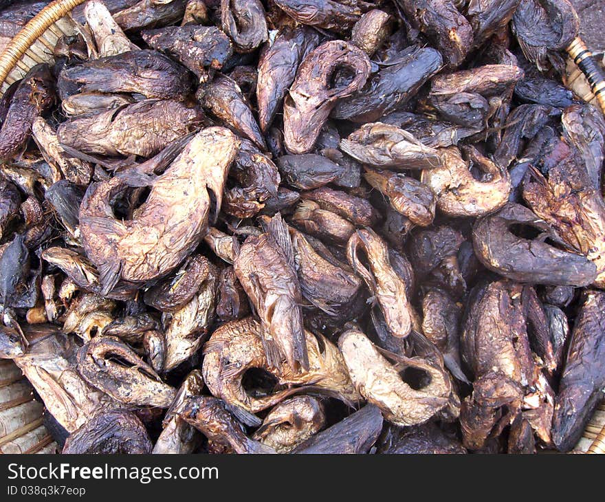 A basket of smoked fish for sale at a market in Mali. A basket of smoked fish for sale at a market in Mali