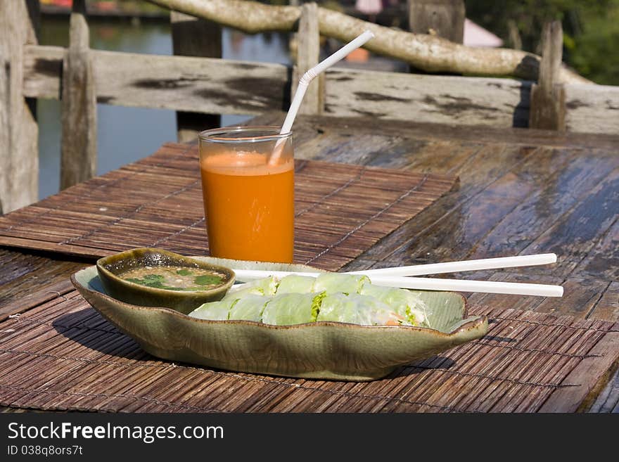 Carrot juice and vegetarian rolls