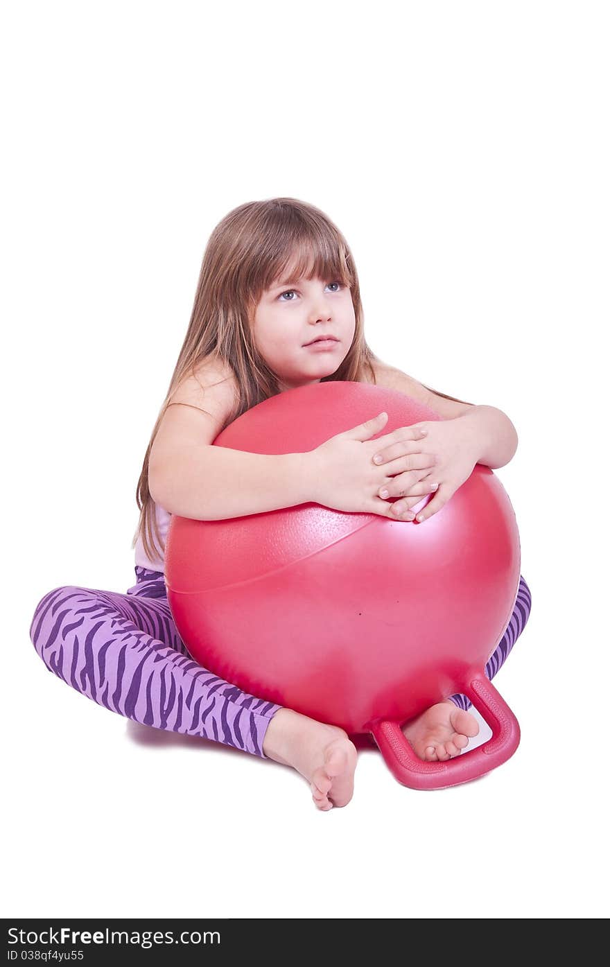 Girl exercise with a red  ball isolated on white