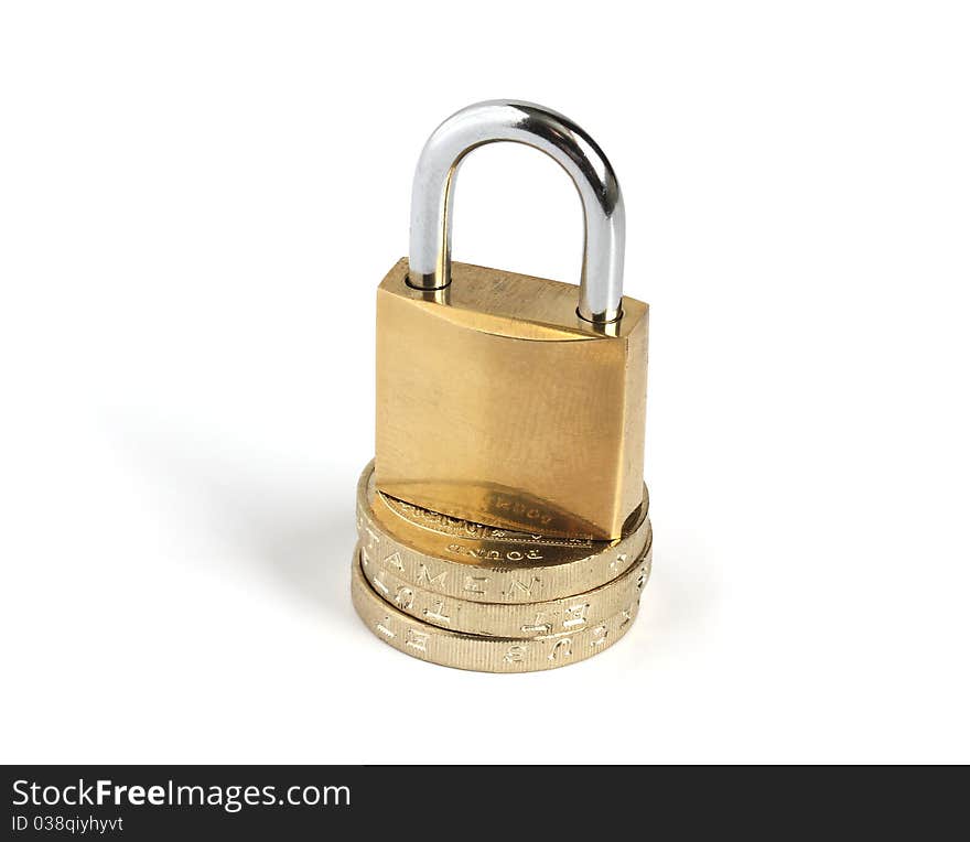 Locked closed padlock standing on a pile of coins isolated on white background. Locked closed padlock standing on a pile of coins isolated on white background