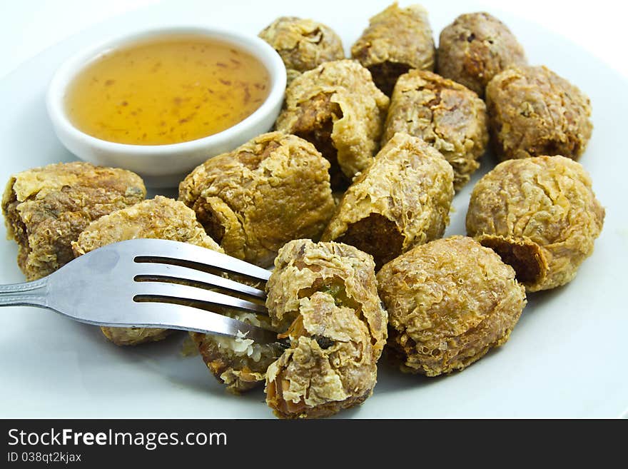 Chiness fried meatball stuffed with crab meat and some vegetable dip with sweet sauce. Chiness fried meatball stuffed with crab meat and some vegetable dip with sweet sauce