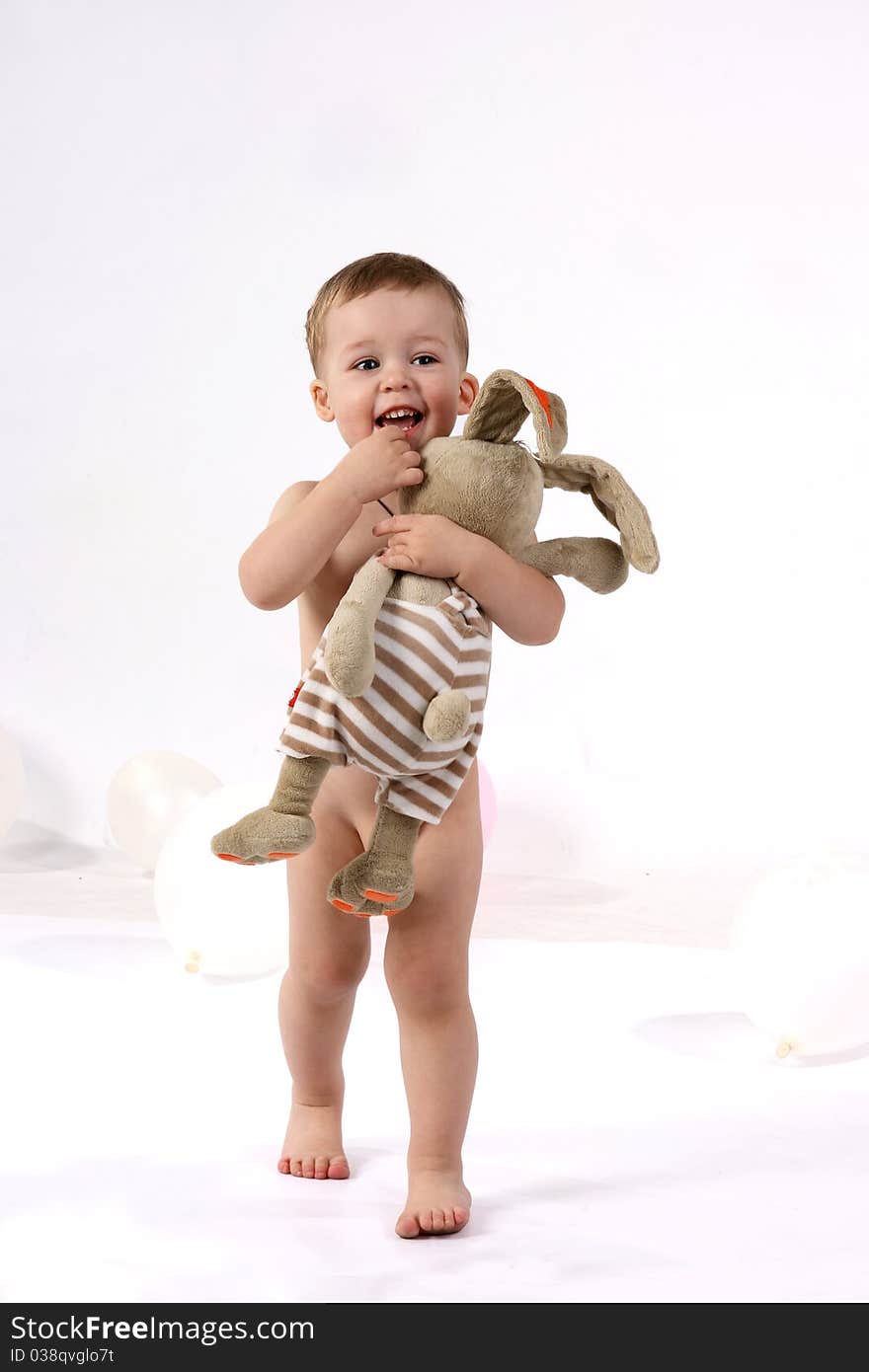 Studio portrait of a little boy with toy