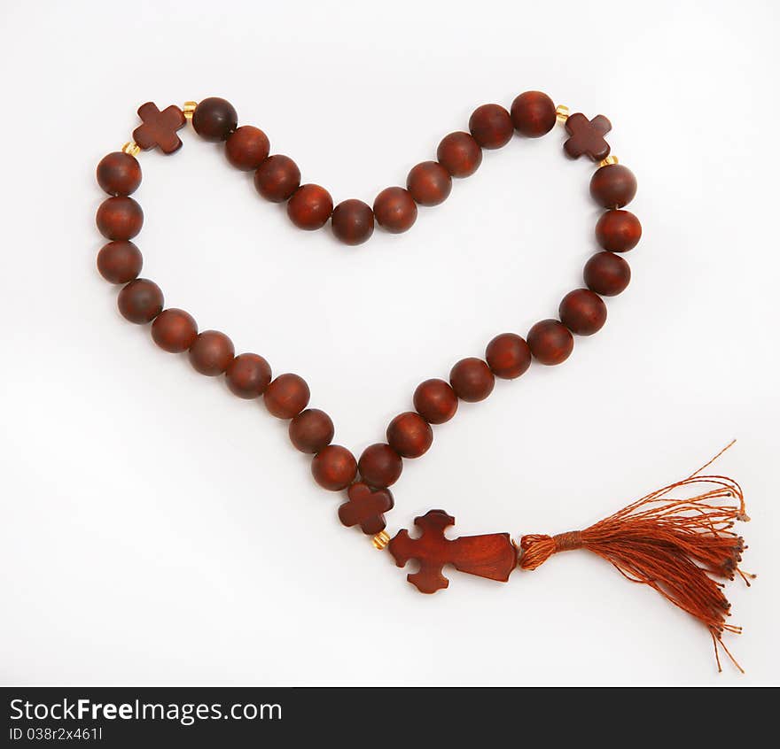 Wooden rosary in the form of heart. Wooden rosary in the form of heart