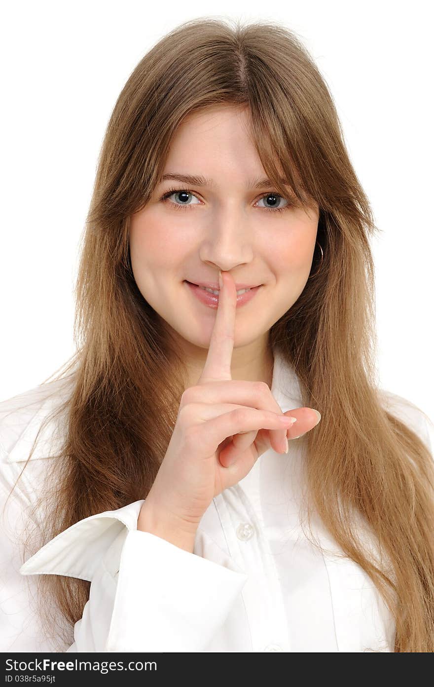 Young woman says ssshhh to maintain silence on a white background