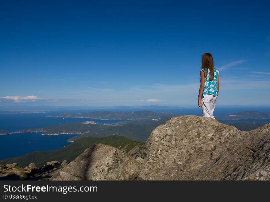 Young girl looking at the island view