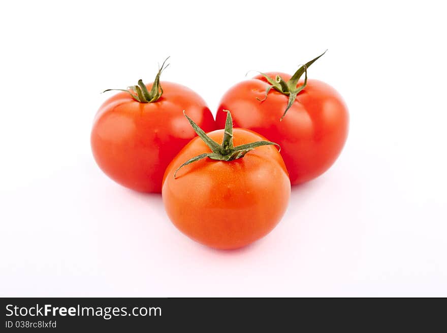 Red tomatoes on white background