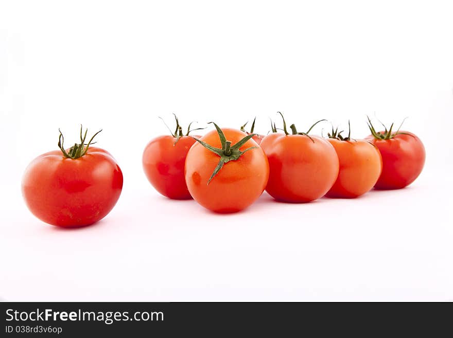 Red tomatoes on white background