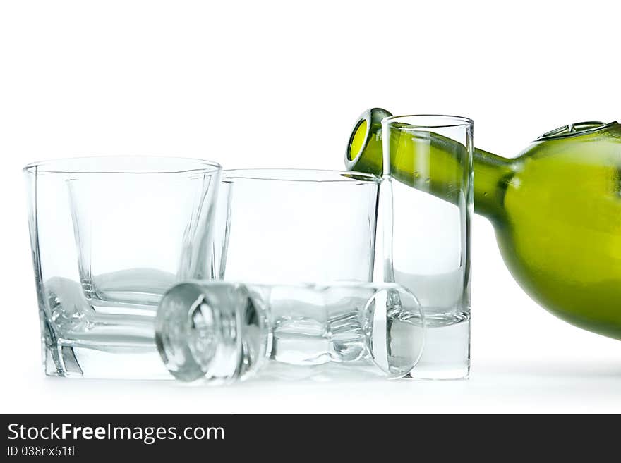 Some glasses for cocktails and empty green bottle. Some glasses for cocktails and empty green bottle