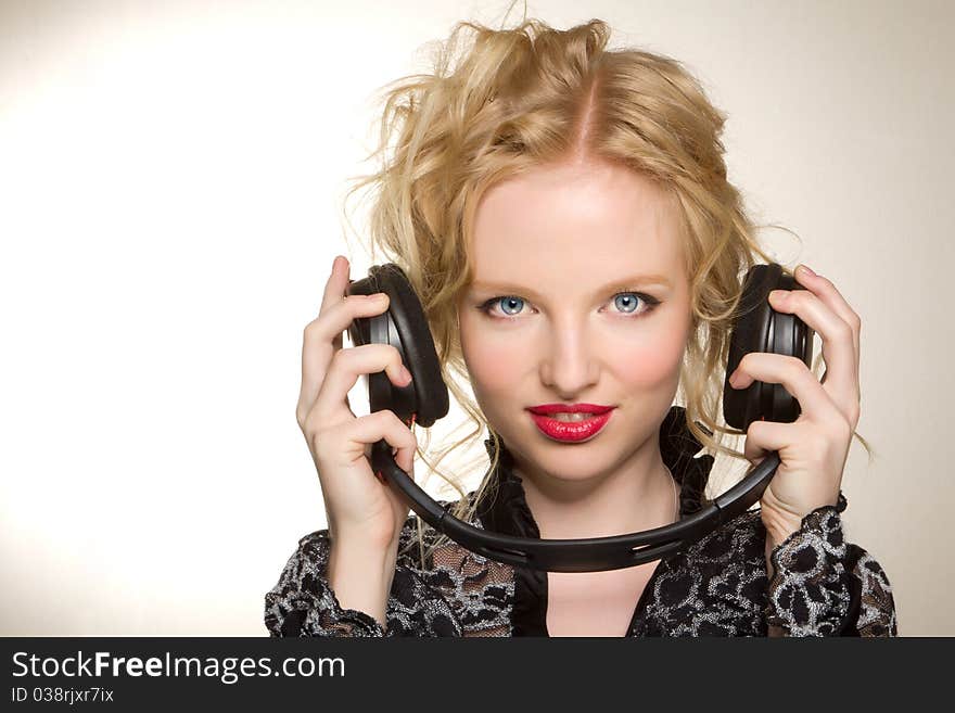 Woman with headphones listening to music over white background