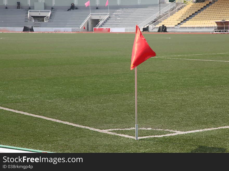 Soccer corner flag in a large stadium filled