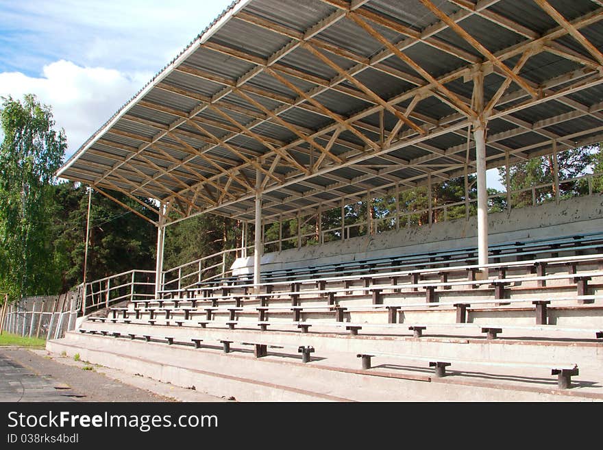 The small stadium with seating and a roof