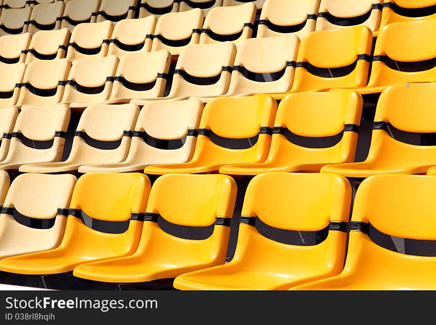 Old and new yellow seat in stadium