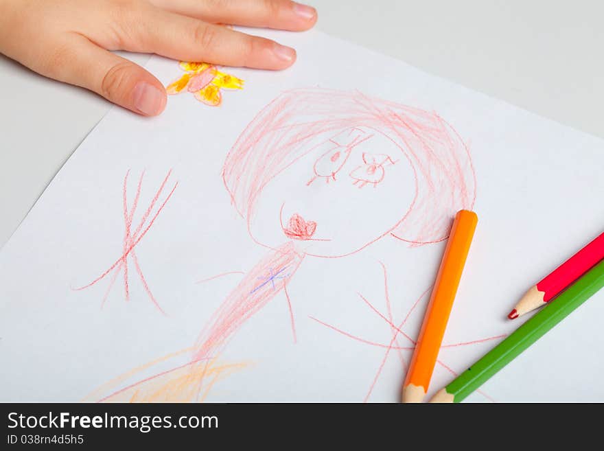 The child draws a picture with crayons. The concept of teaching drawing, children's creativity. The child draws a picture with crayons. The concept of teaching drawing, children's creativity