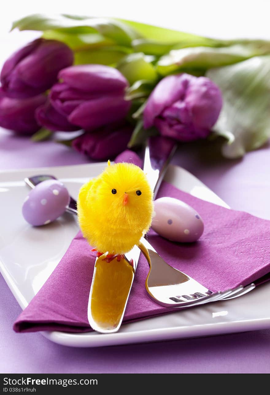 Easter table setting with biddy and cutlery