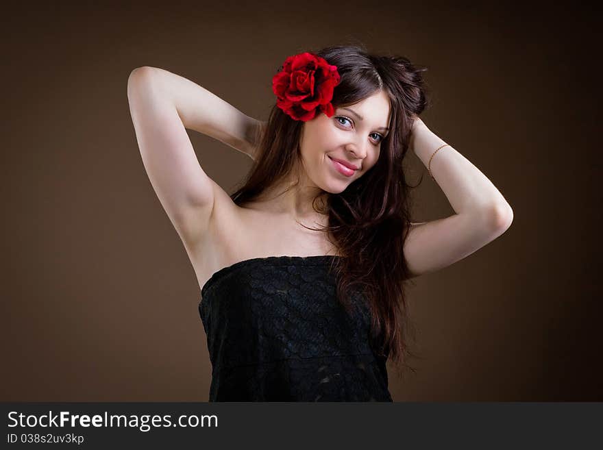 Portrait of attractive woman with flower in hair