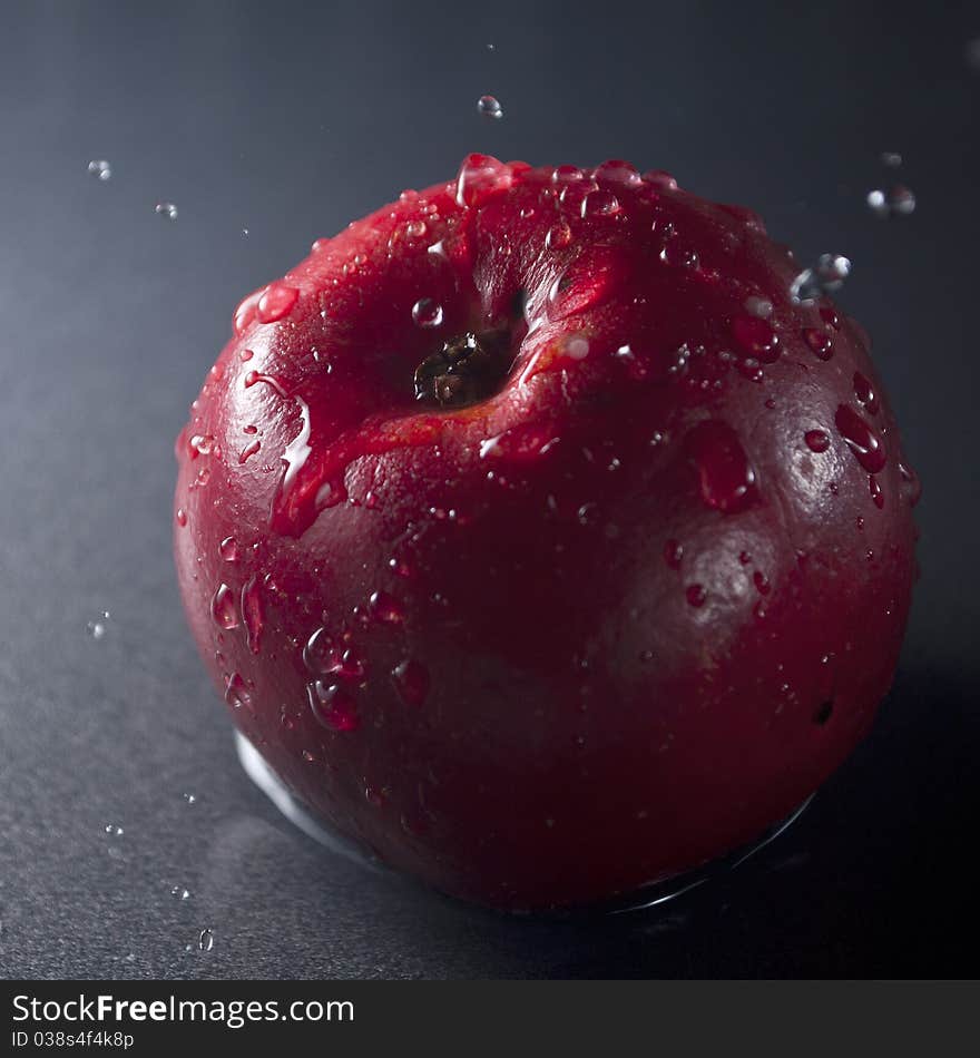 Playing with apple and water splashes