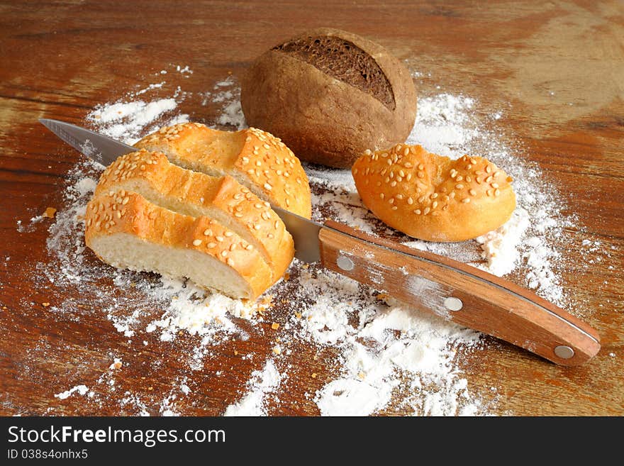 Rye and wheat bread on a wooden table