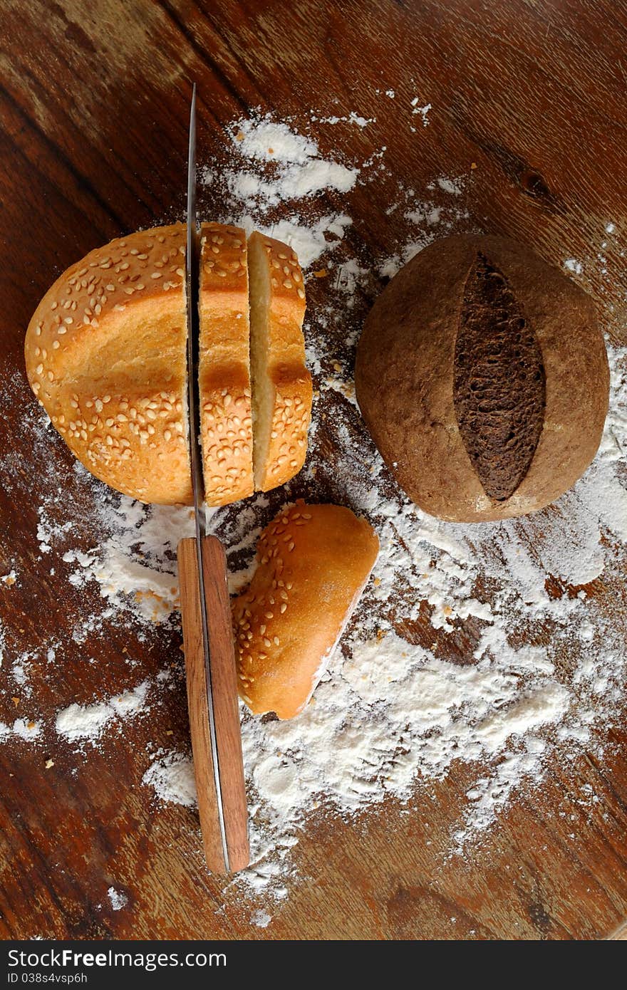 Rye and wheat bread on a wooden table