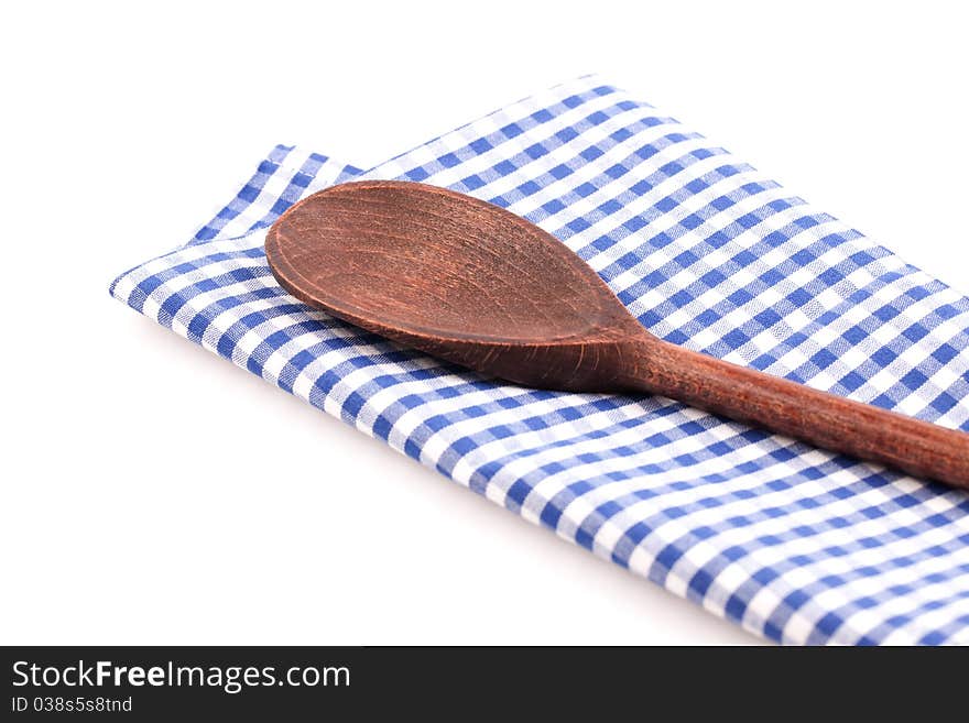 Wooden spoon on dishtowel