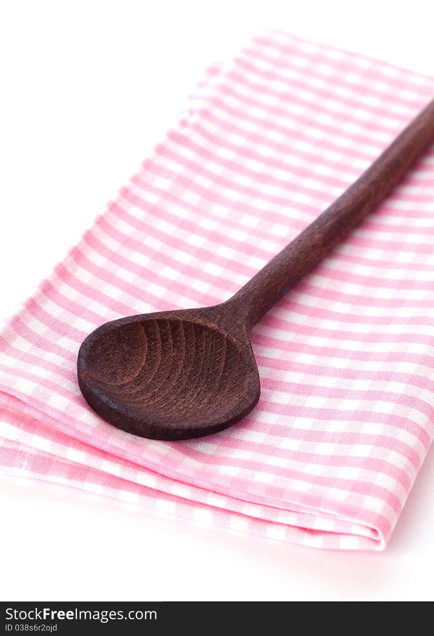 Wooden spoon on dishtowel