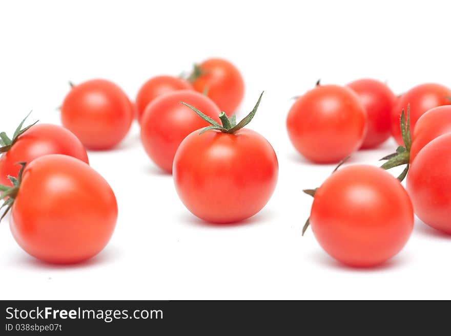 Beautiful ripe cherry tomatoes isolated on white background. Beautiful ripe cherry tomatoes isolated on white background