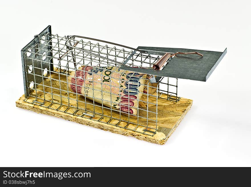 Mouse trap with banknote on white background