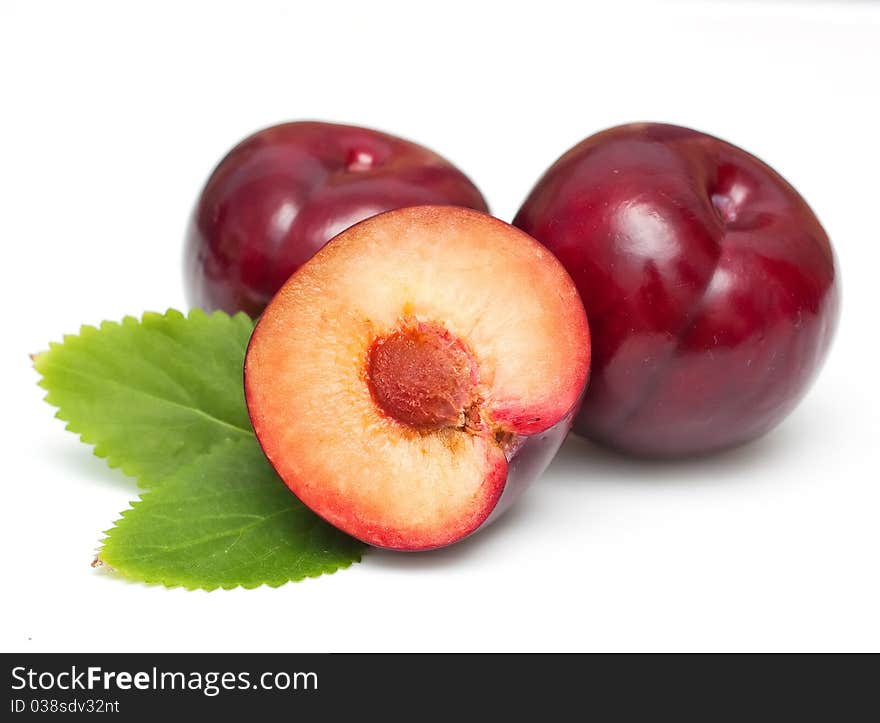 Plums isolated on white