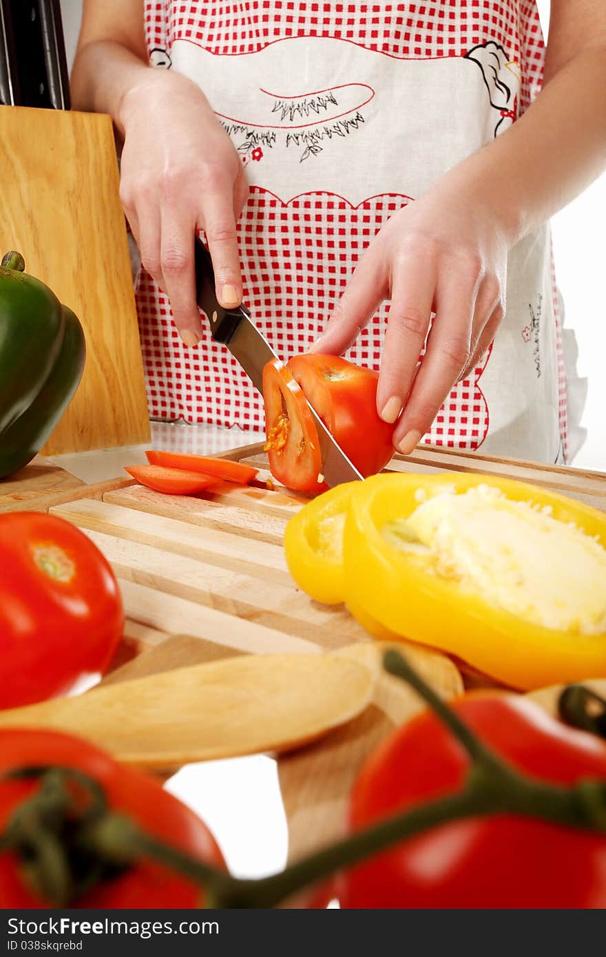 Tomato cutting on a wooden plate