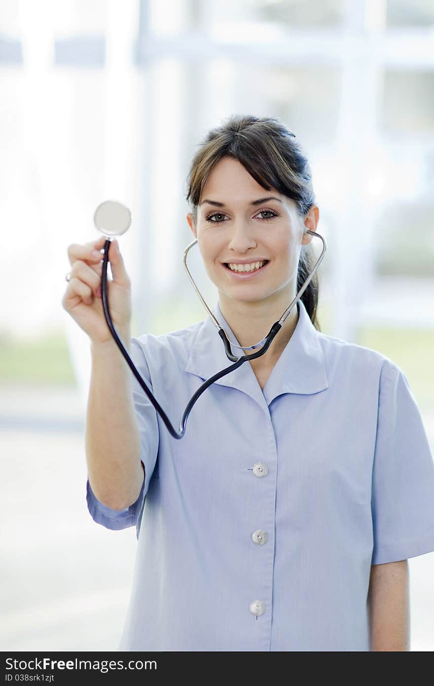 Friendly Smiling Female Nurse Holding Stethoscope. Friendly Smiling Female Nurse Holding Stethoscope