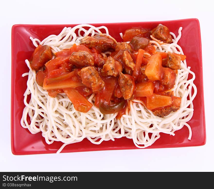 Chinese food - sweet and sour chicken with chow mein noodles