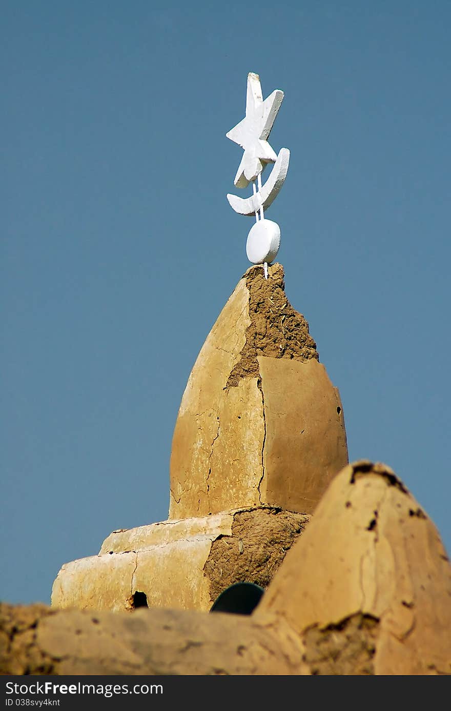 Spire on mud mosque in West Africa