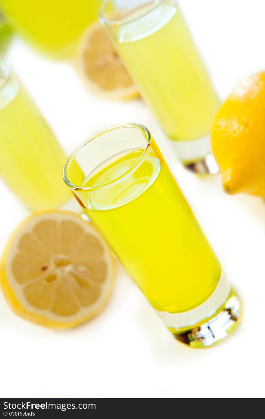 Tall shot glasses full of the italian lemon liquor lemoncello