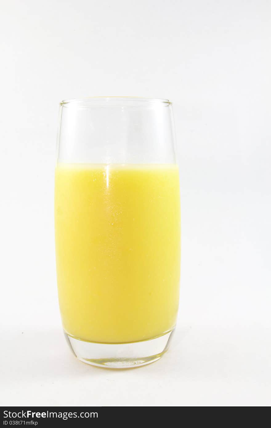 A glass of corn juice on a white background