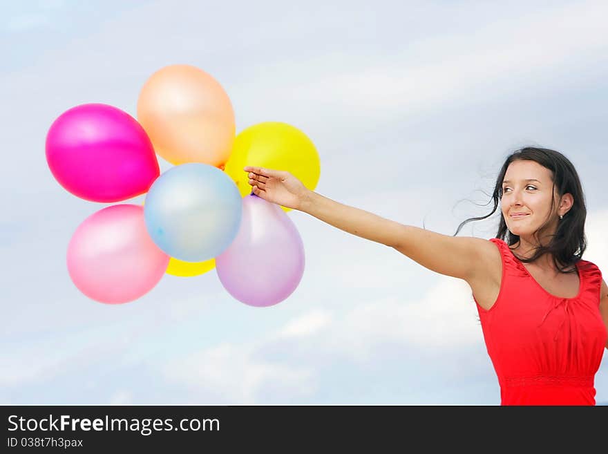 Young Attractive Woman With Colorful Balloons