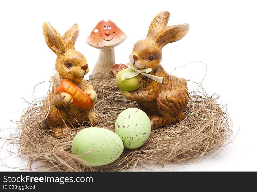 Easter bunnies with mushroom in the hay