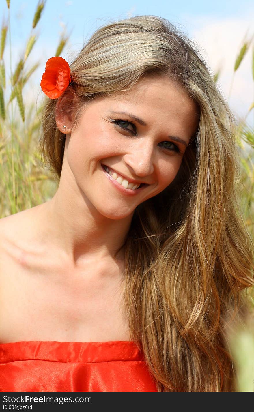 Portrait of beautiful woman in red dress