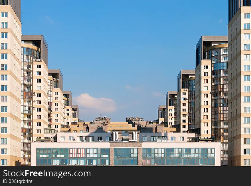 Dwelling houses constructed cascade on the blue sky background