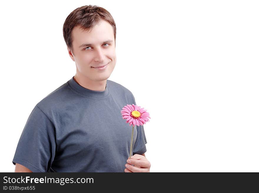 Young man with flower in hands