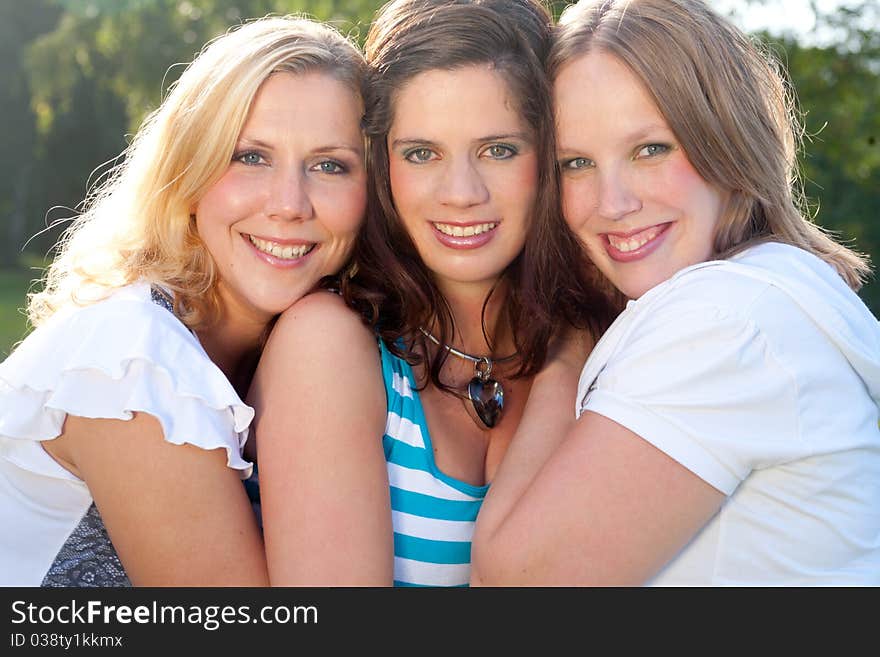 Girlfriends are having fun in the park. Girlfriends are having fun in the park