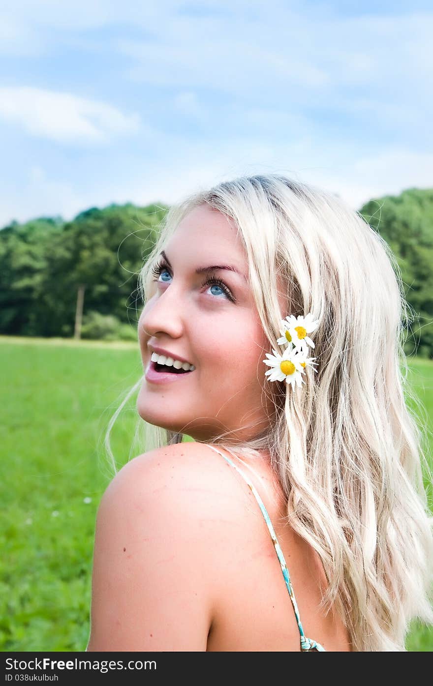 Beautiful girl on the meadow