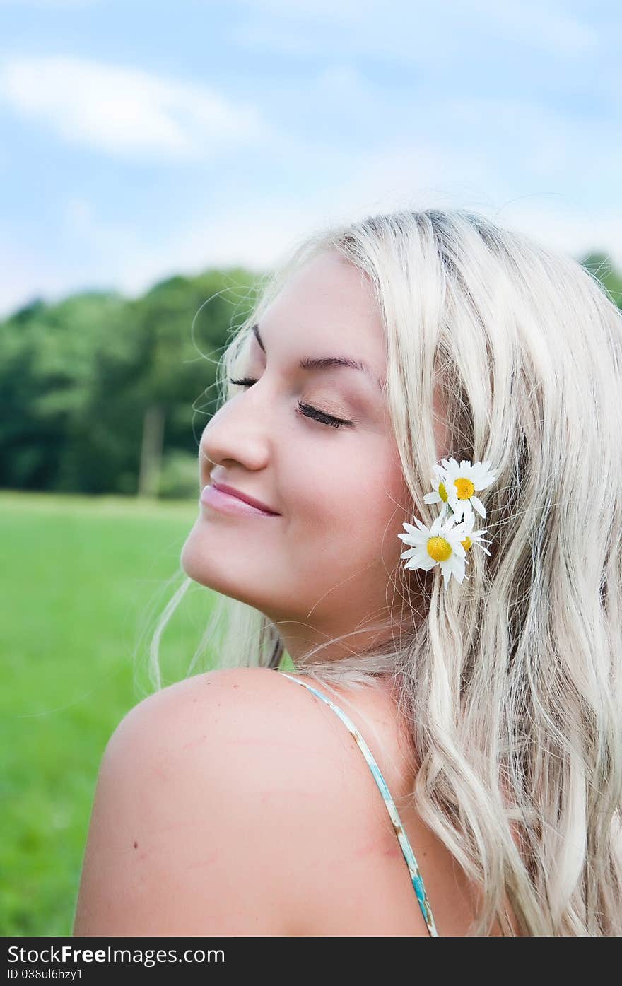 Beautiful girl on the meadow