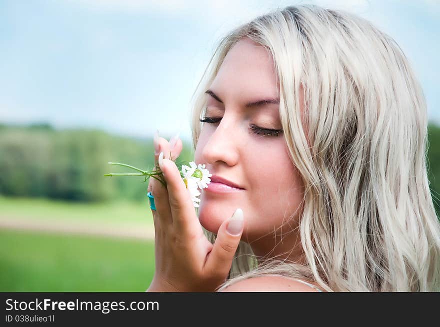 Beautiful girl on the meadow