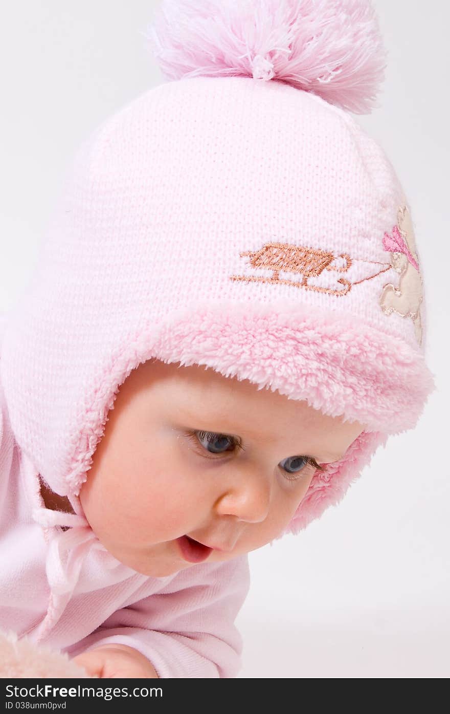 Little child baby in a pink hat