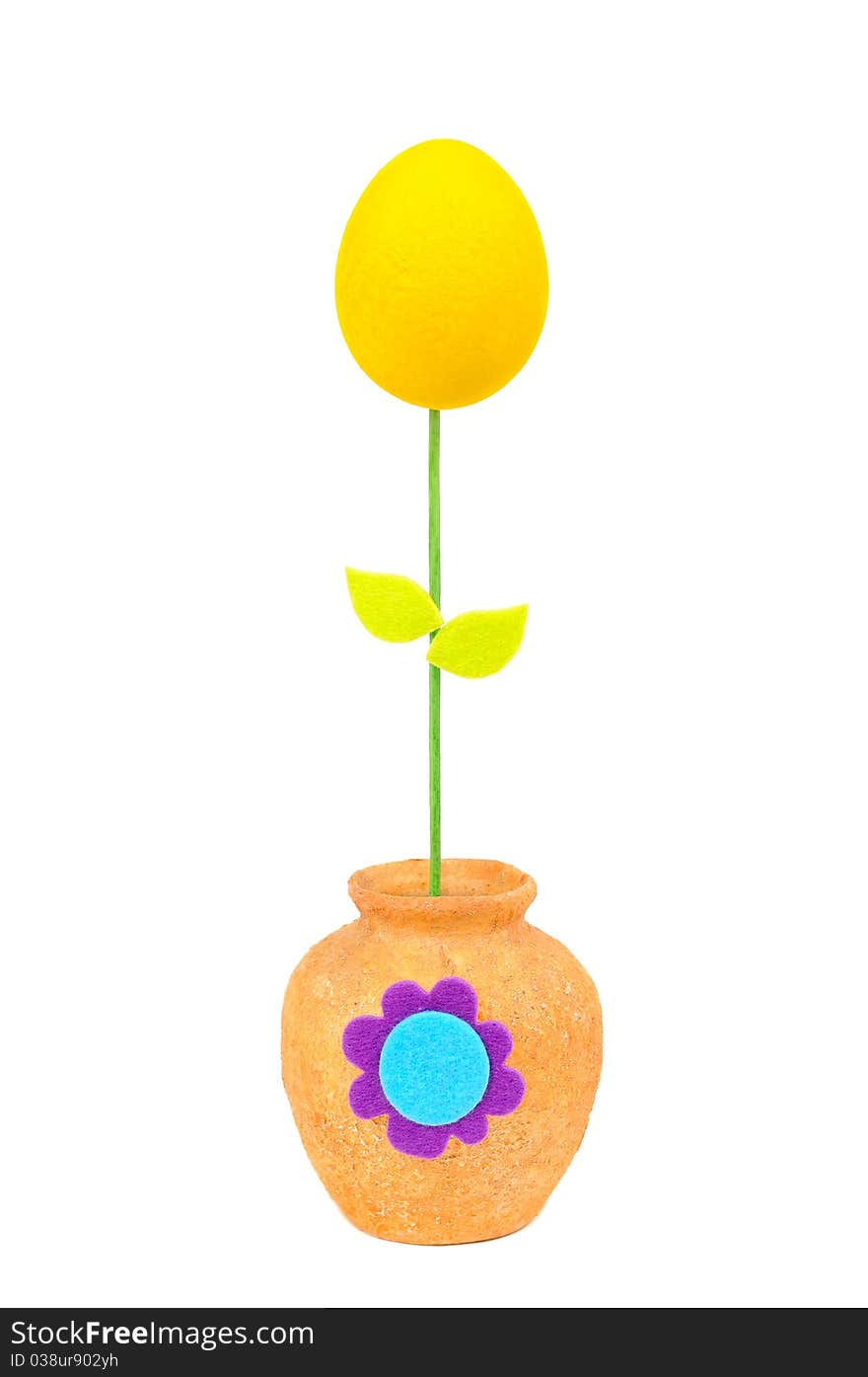 Colourful Easter egg in a yellow vase. Isolated on the white